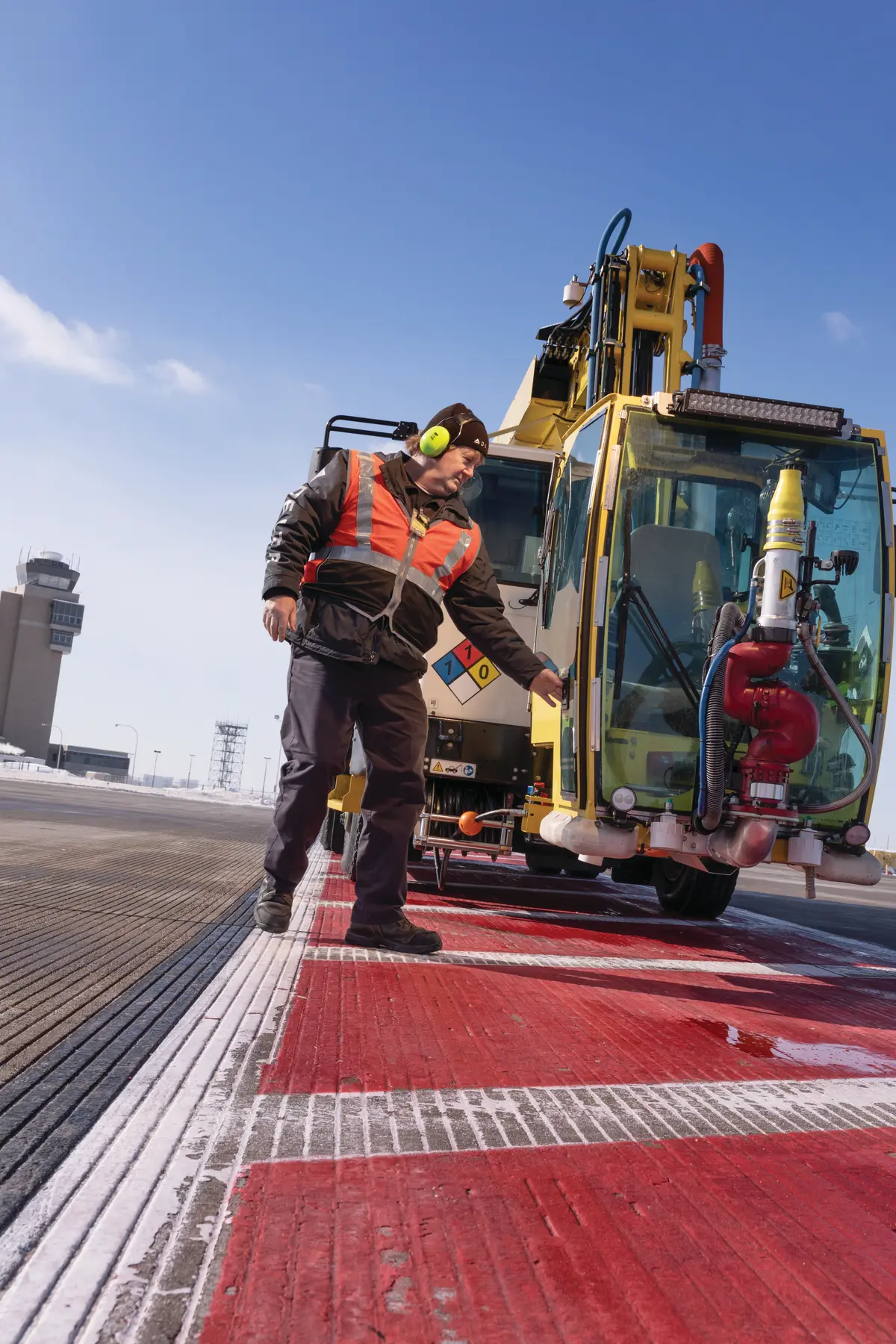 Ramp Agent Bruce Torseth prepares to de-ice aircraft at Minneapolis-St. Paul International Airport.