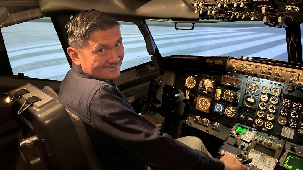 After a few fun trips in the Boeing 737-200 flight simulator, Todd O., Delta's most frequent flyer, prefers to fly in Delta One than a pilot seat. 