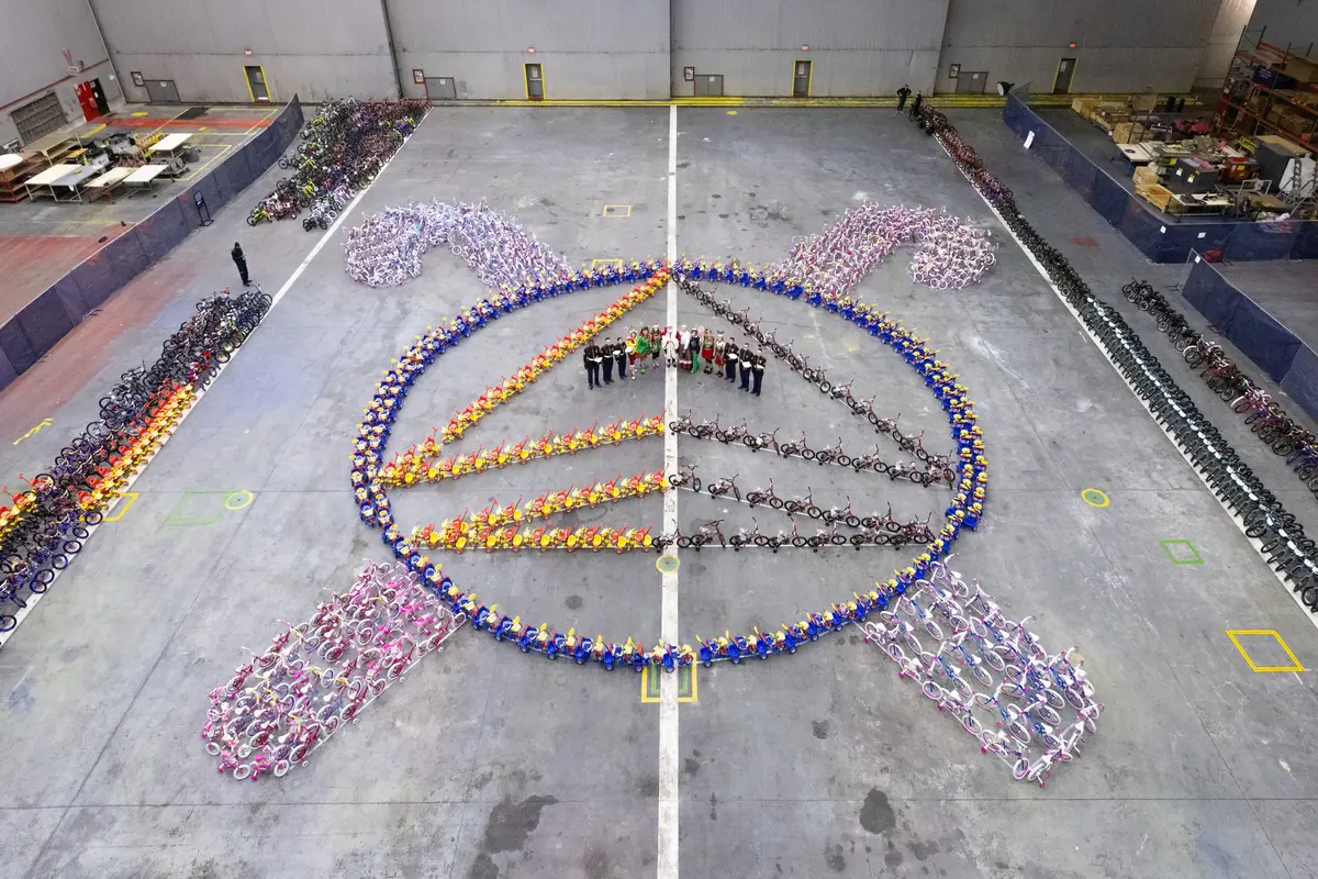 Leading up to the Delta TechOps Toys for Tots event, pink and blue bikes lined the halls of the TechOps facility and bikes were assembled in the shape of the Delta Widget with candy canes around it.