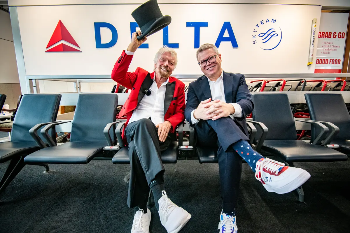 Sir Richard Branson and Delta Chief Marketing & Communications Officer Tim Mapes post for a photo during an event with Virgin Voyages.