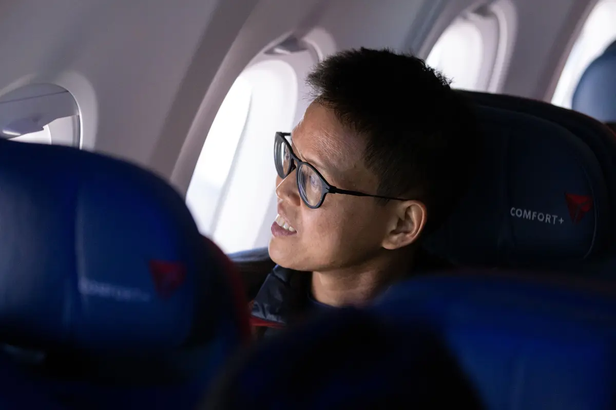 Customers on board DL 1010 from Dallas Fort Worth International Airport (DTW) to Detroit Wayne County Metropolitan Airport (DFW) view the solar eclipse.
