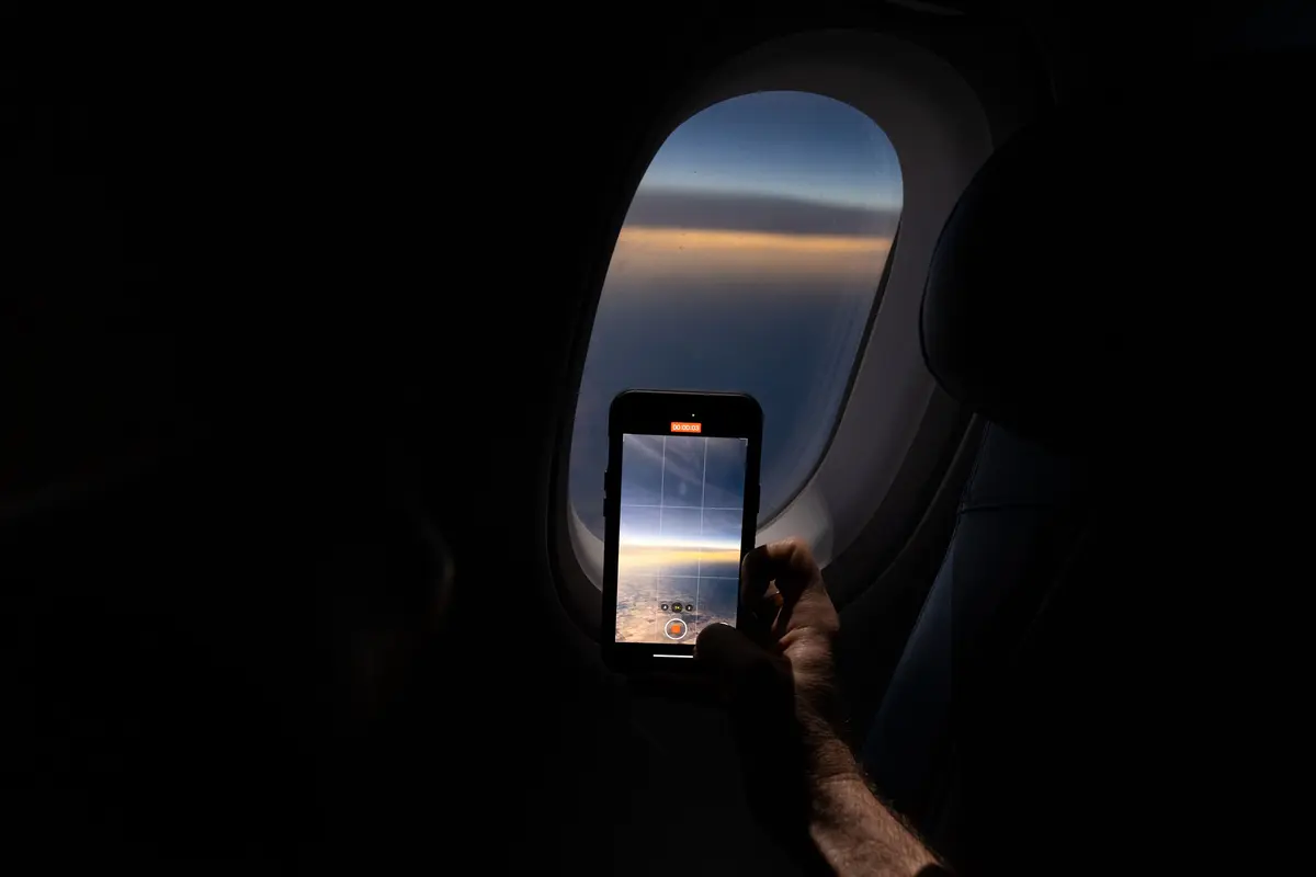 Customers on board DL 1010 from Dallas Fort Worth International Airport (DTW) to Detroit Wayne County Metropolitan Airport (DFW) view the solar eclipse.