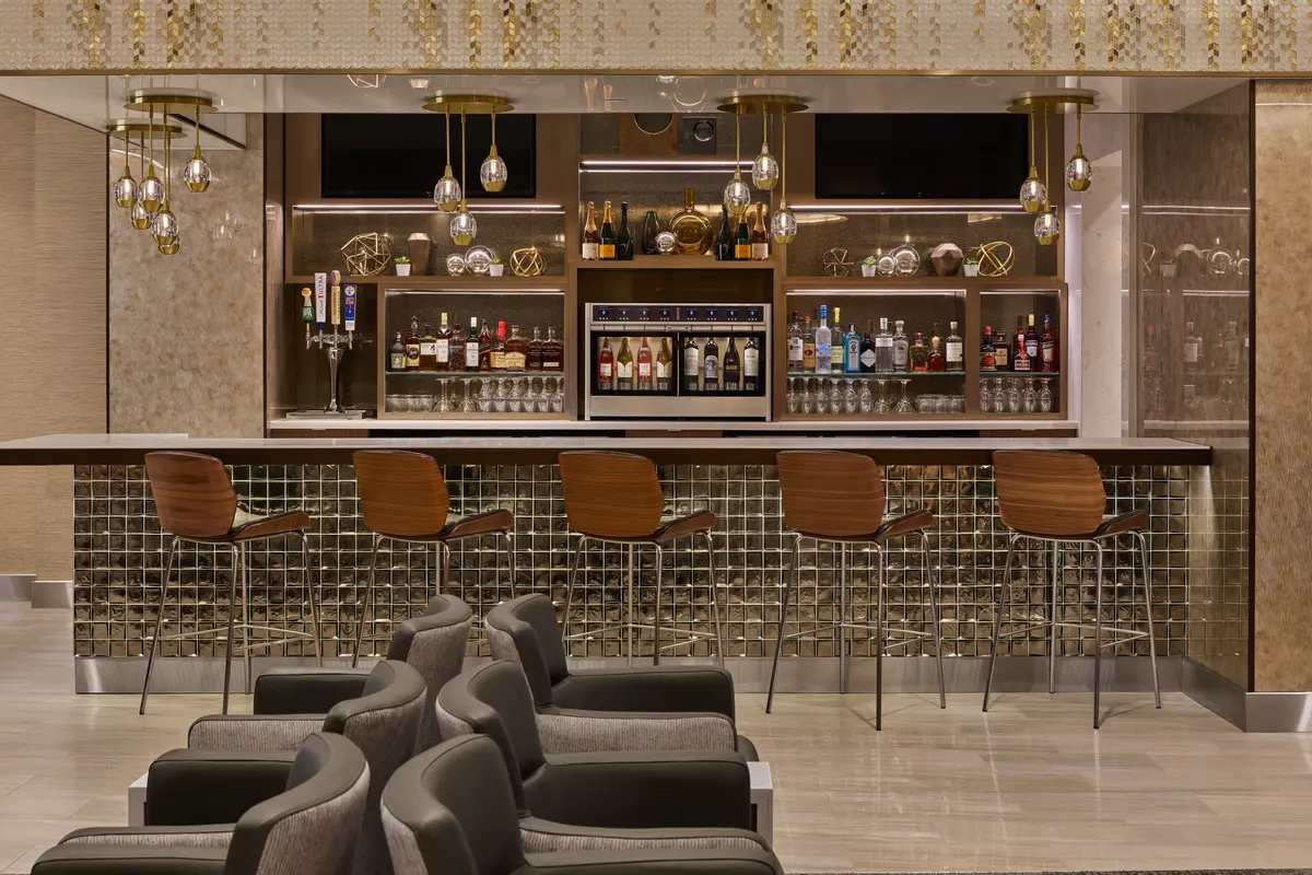 The Delta Sky Club at Detroit Metropolitan Airport features a premium bar that provides guests with access to complimentary beverages as well as upgraded options like premium wines, spirits, beer and signature cocktails. 