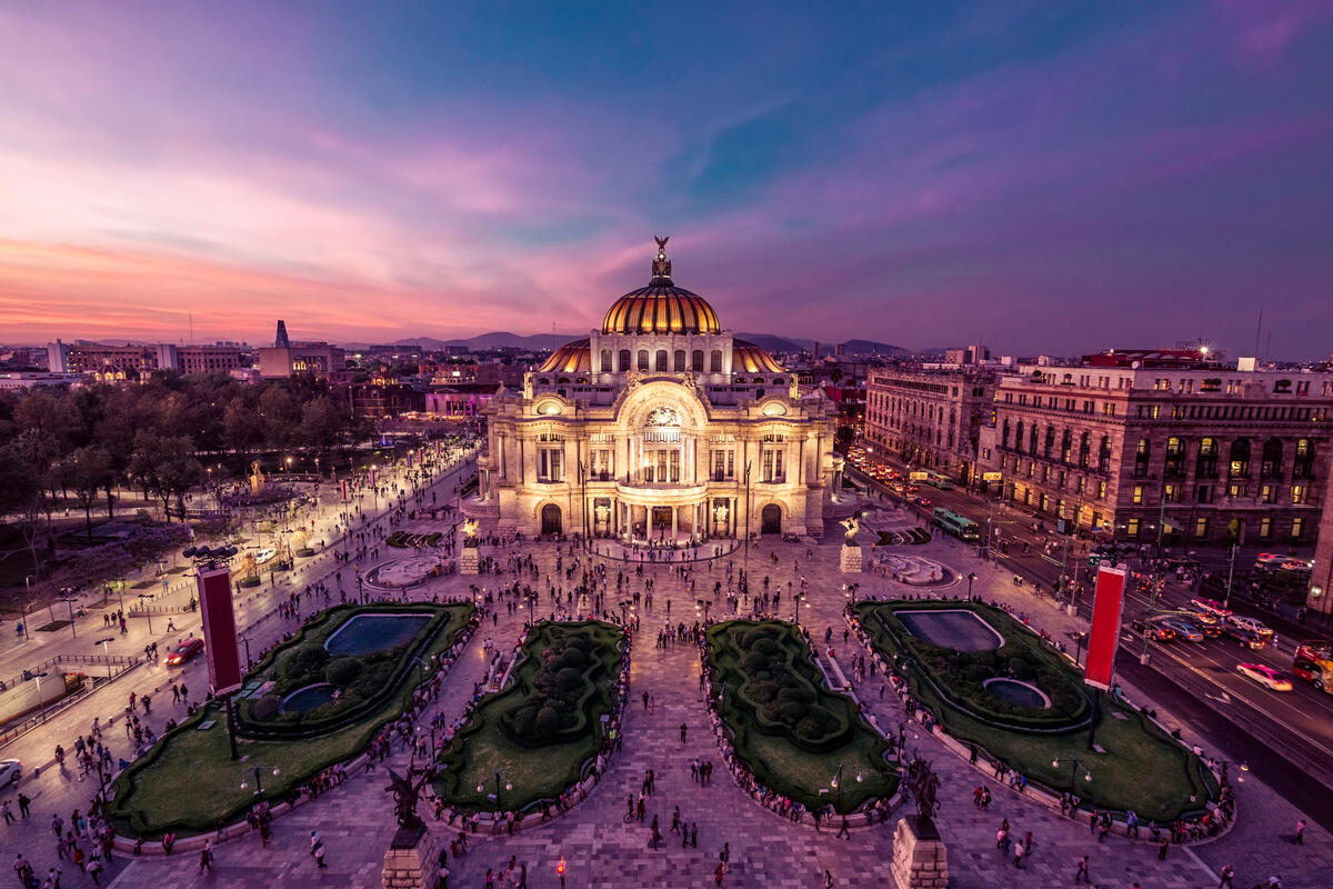 The Palacio de Bellas Artes in Mexico City gleams at twilight.