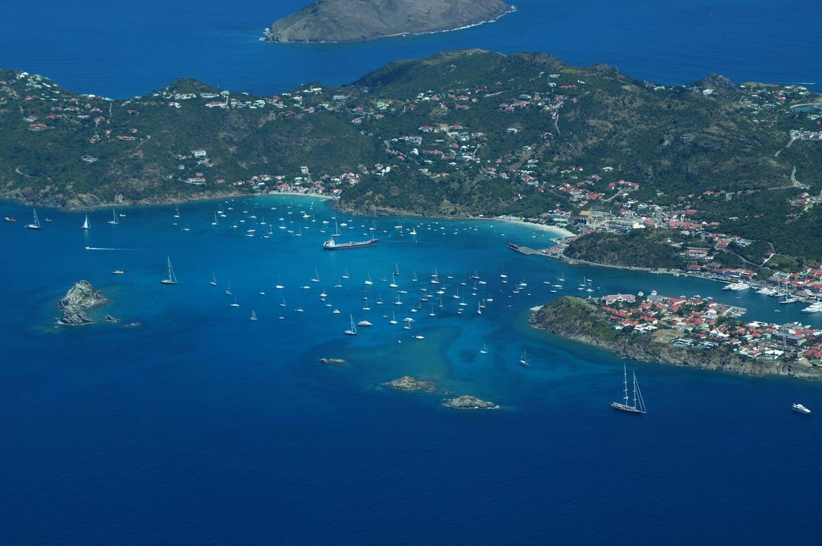 An aerial view of St. Kitts and Nevis with several yachts