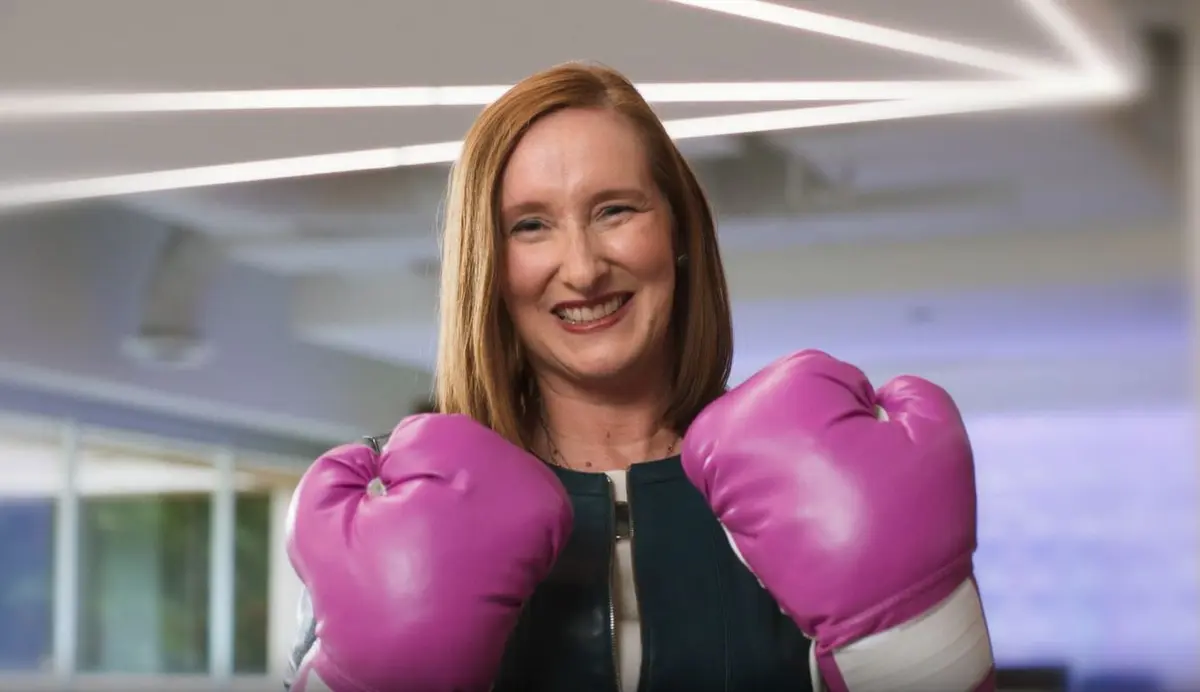 When Kristen Manion Taylor, Senior Vice President of In-Flight Service, announced her breast cancer diagnosis to her “Delta family,” a care package from her “survival sister,” Marenda Hughes Taylor, contained the ultimate memento for the battle ahead: a pair of pink boxing gloves. 