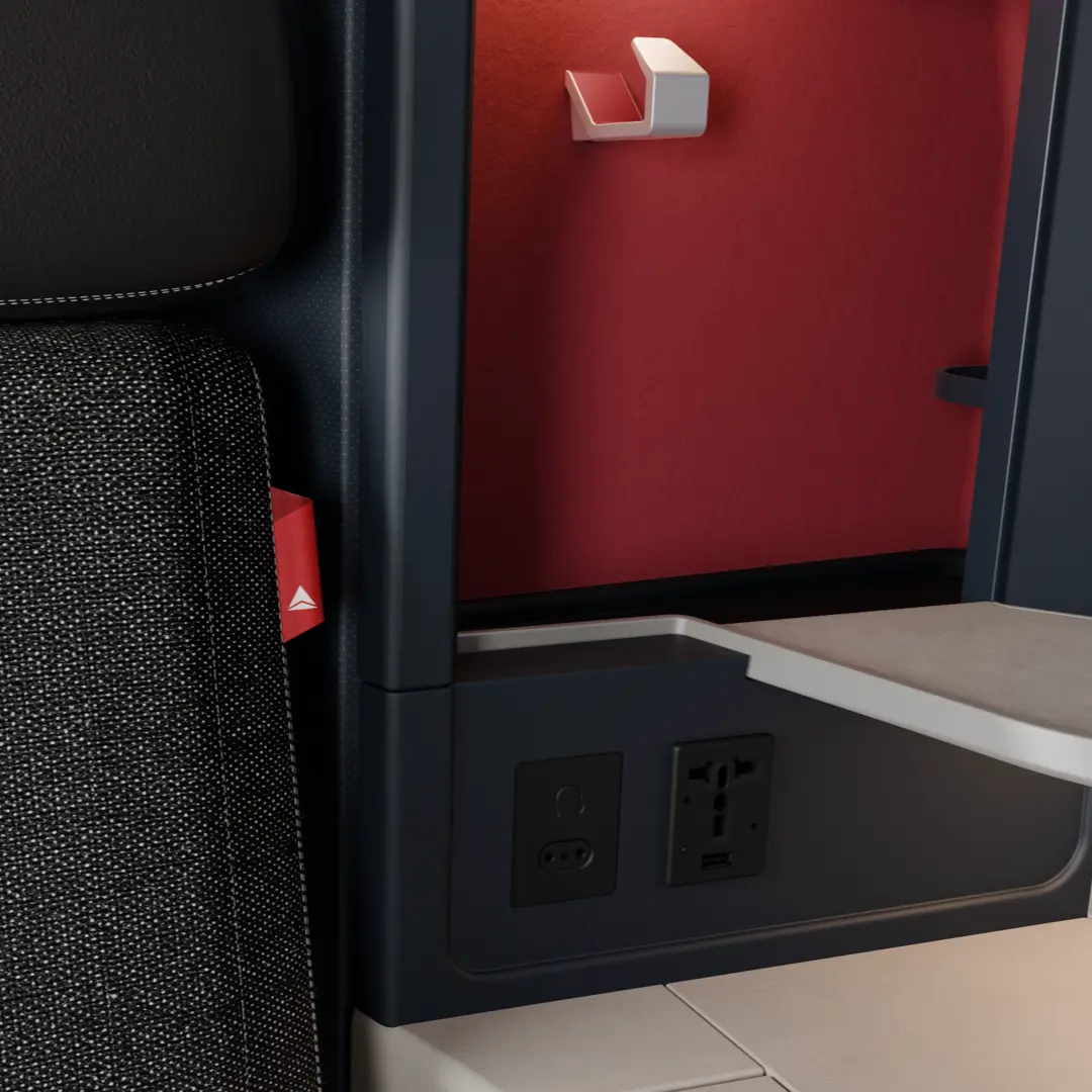 A “thread of red” is being introduced in premium cabins to highlight customer features like an extra pocket on the seat in front of you or the location of a headset. 