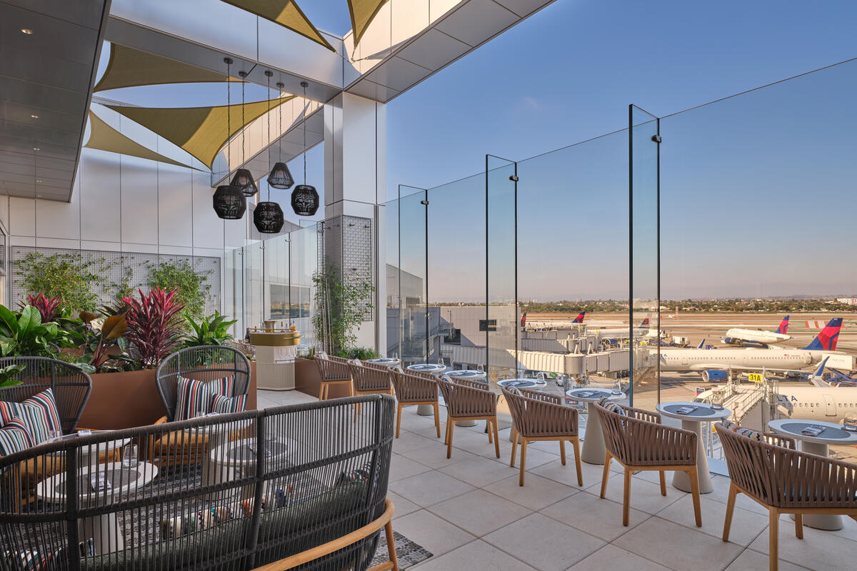 The landscaped terrace, featuring seating for 26, includes accent pillows furnished by Delta One luxury brand partner Missoni. 