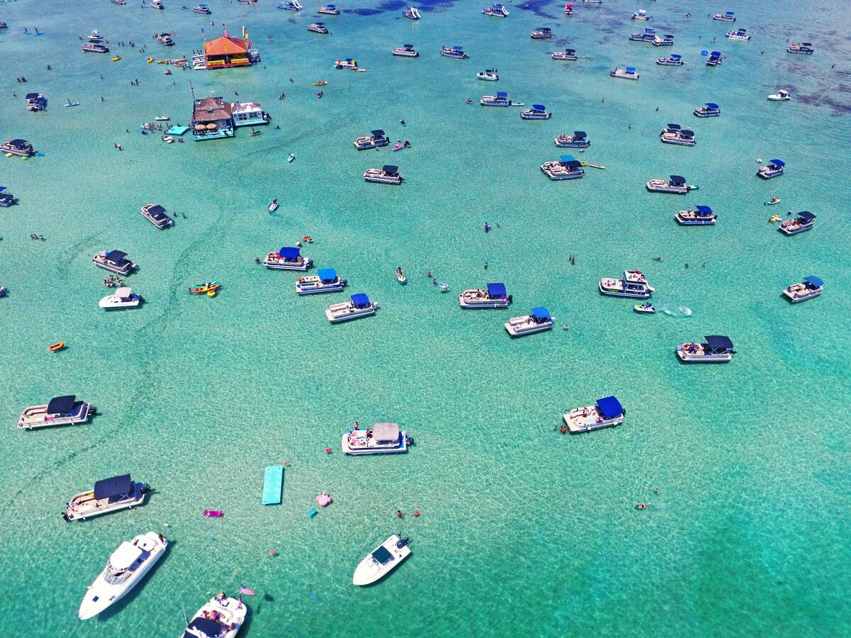 Aerial view of boats on crystal blue waters in Destin, Florida