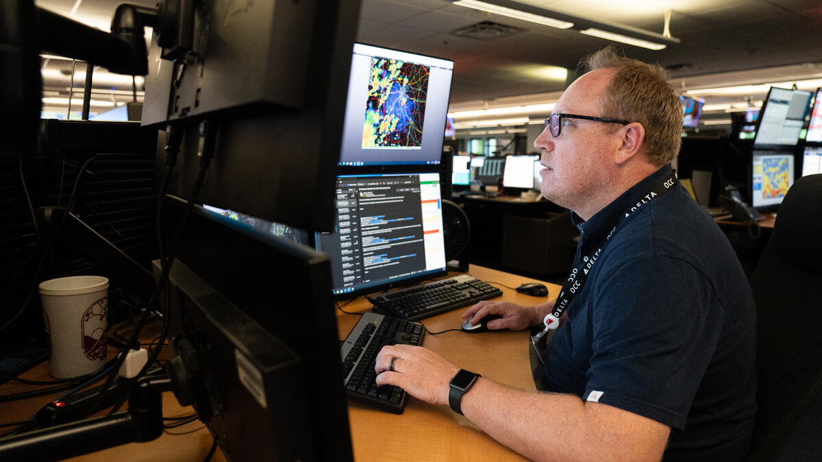 Warren Weston, a member of Delta's in-house meteorology team, working inside the Operations and Customer Center in Atlanta.