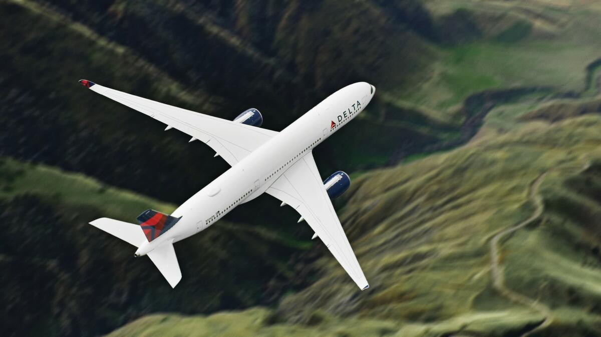 A Delta aircraft is pictured in flight.