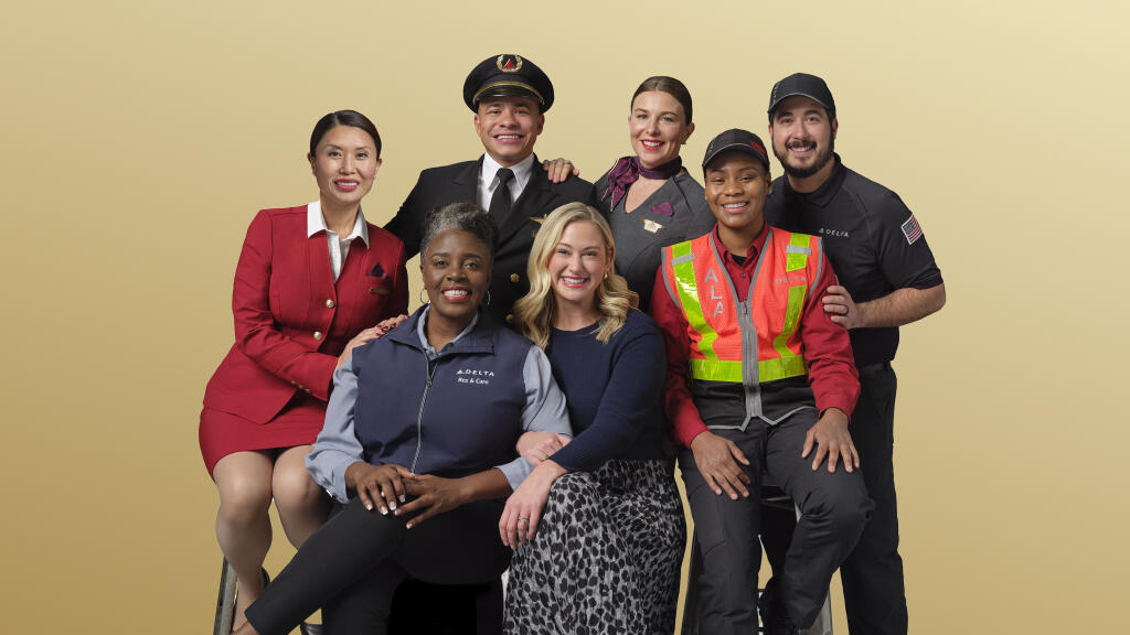 Delta people from across the airline's business pose in this 2024 photo.