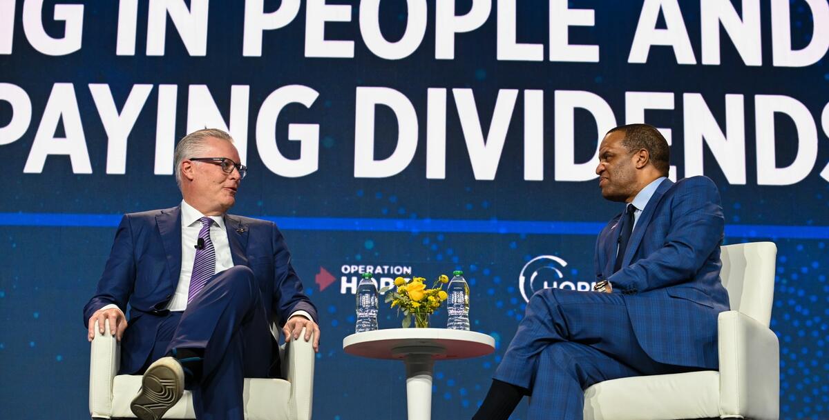 Delta CEO Ed Bastian (left) speaks at the HOPE Global Forum.