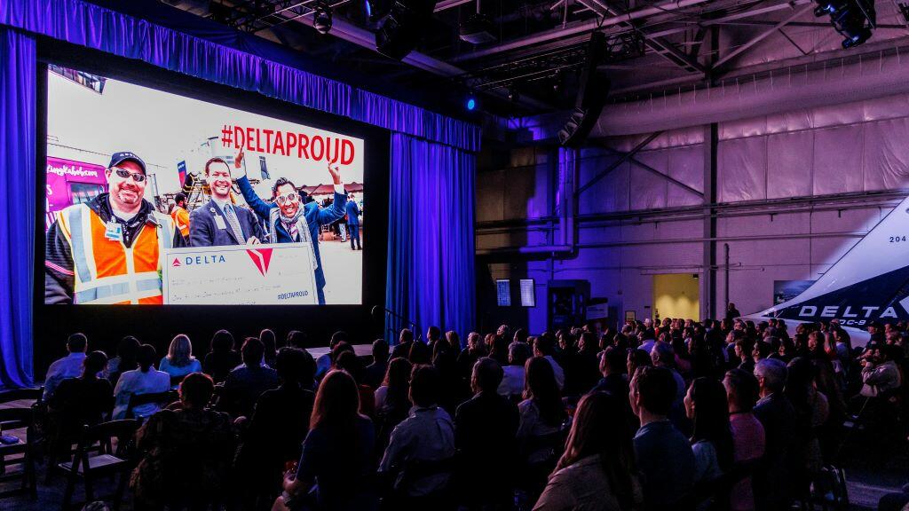 Delta employees watch the screening of Delta's documentary "The Steepest Climb."