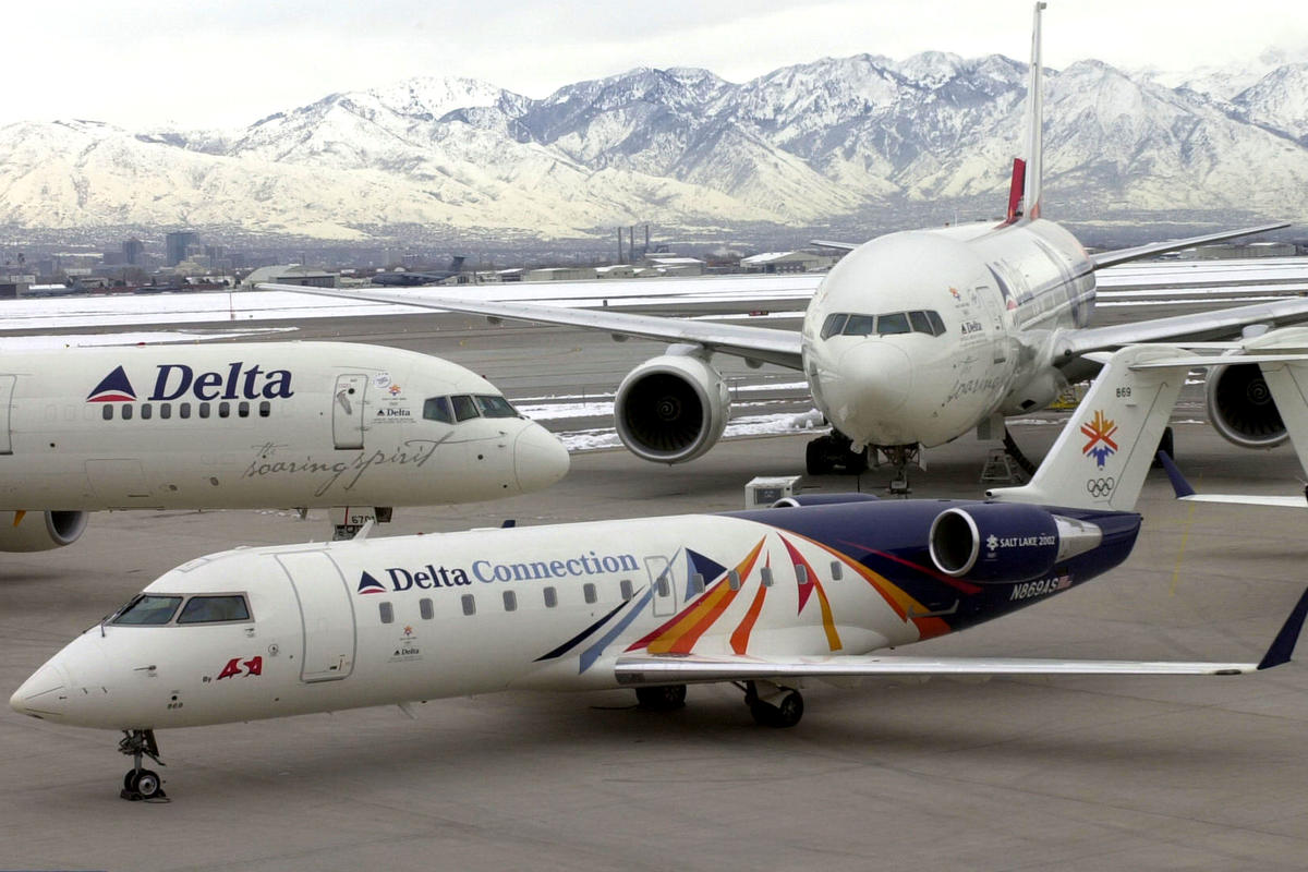 A Delta Connection aircraft adorned in a custom livery commemorating the 2002 Olympic Winter Games alongside Soaring Spirit I and Soaring Spirit II. (Courtesy Delta Museum)