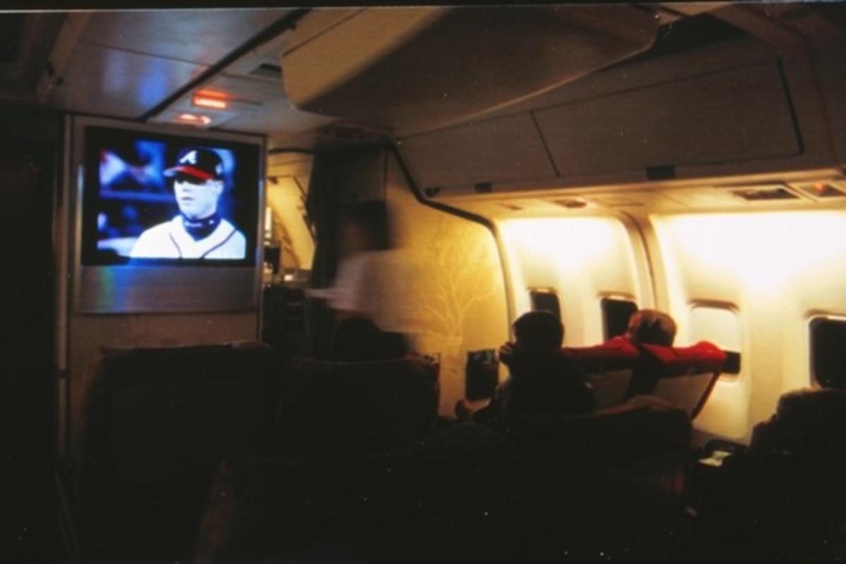 Passengers onboard Spirit of Delta watch a 1996 baseball postseason game featuring the Atlanta Braves live.