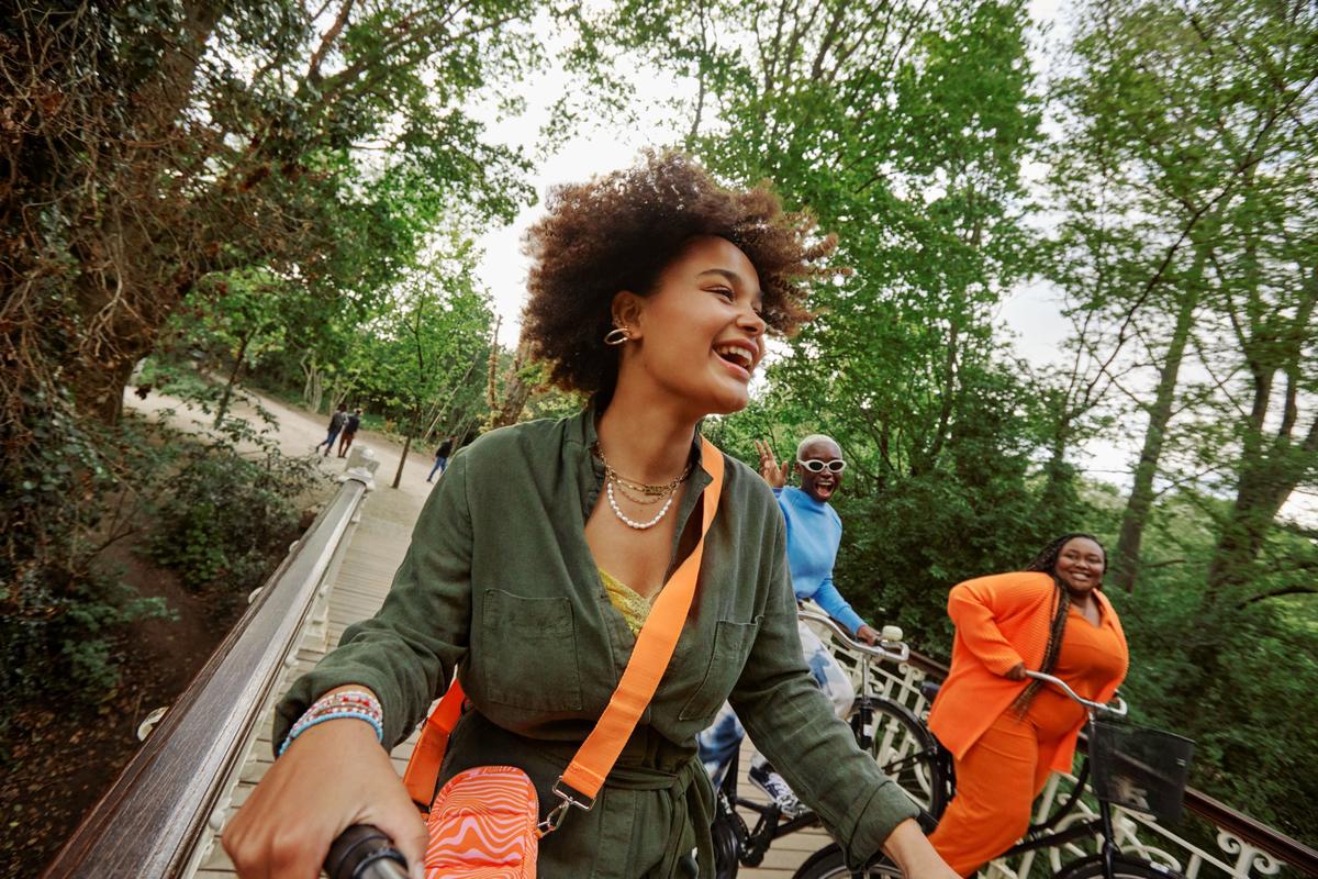Three women bicycling in Vondelpark, Amsterdam