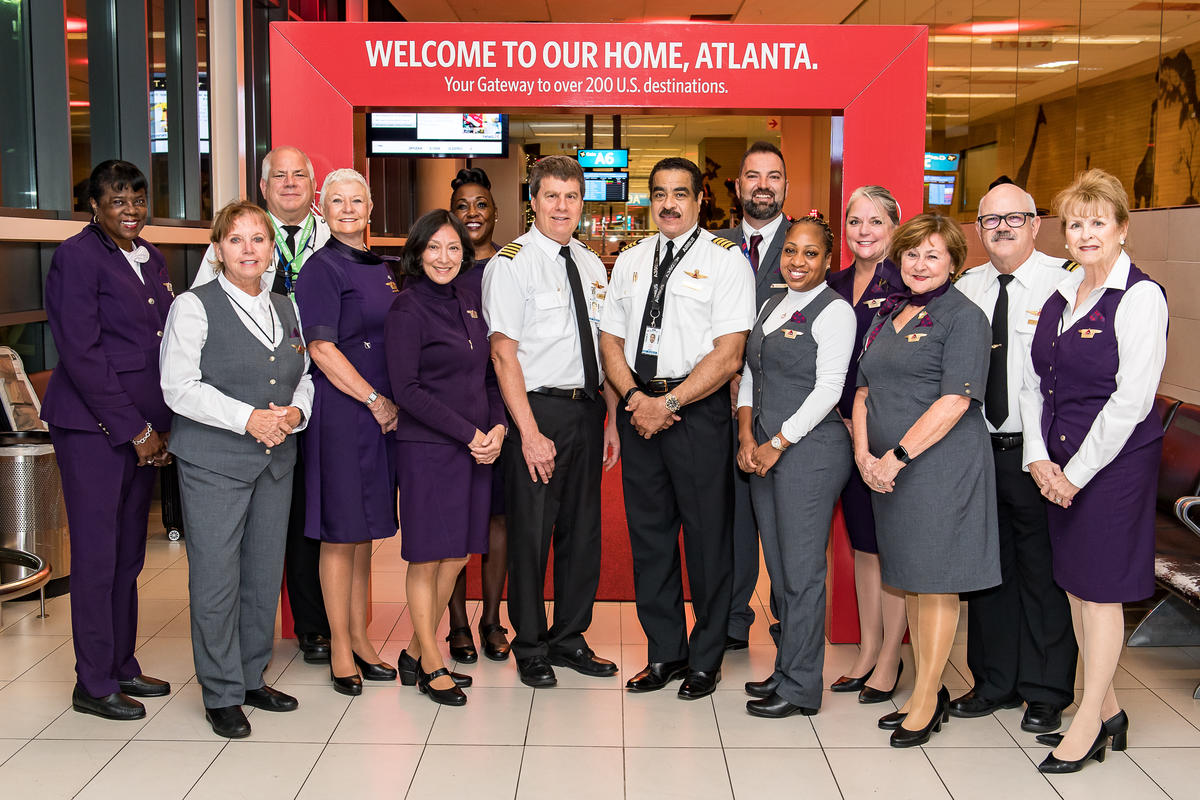 A Delta Flight Crew including pilots and flight attendants celebrate the airline's first flight from Cape Town, South Africa to Atlanta, Georgia, United States.