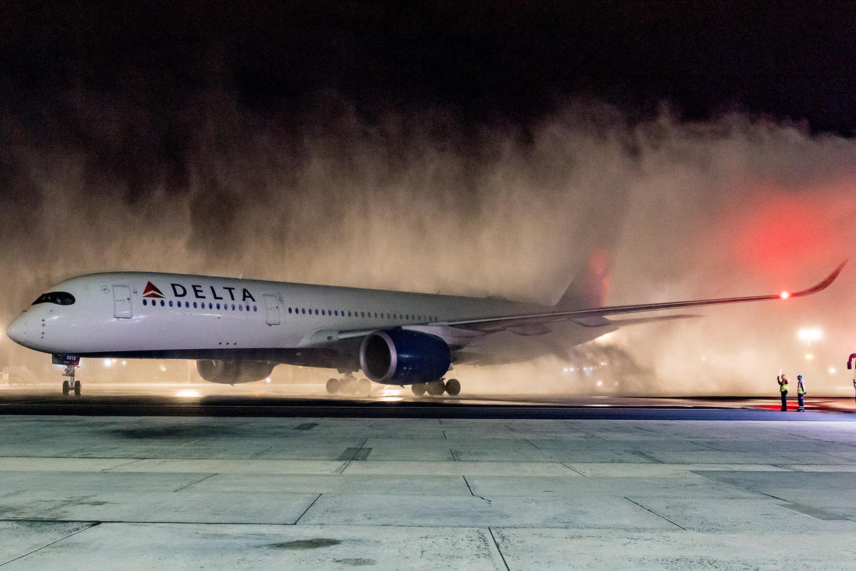 A Delta Air Lines Airbus A350 is welcomed with a water cannon salute upon arrival at Cape Town International Airport (CPT).