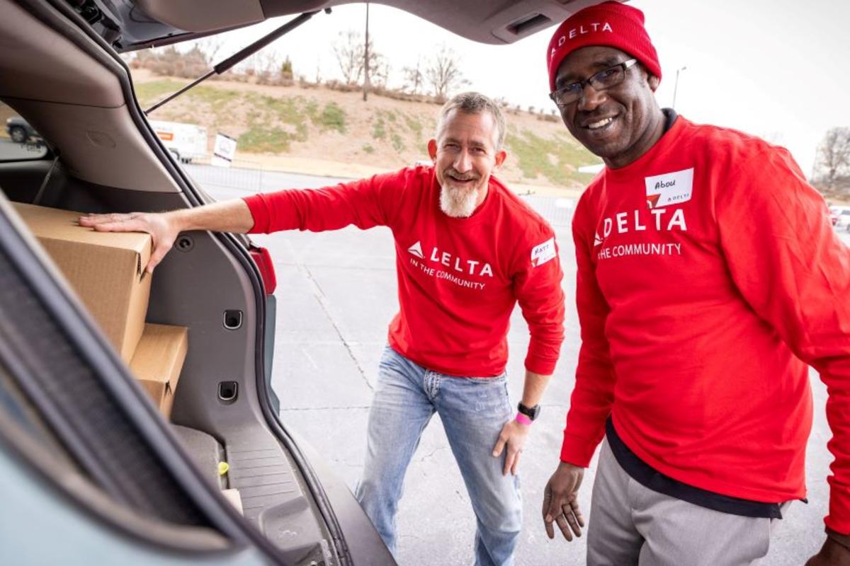 Two Delta employees volunteer at Hosea Helps in Atlanta during the annual "Hosea Helps Festival of Services" event.
