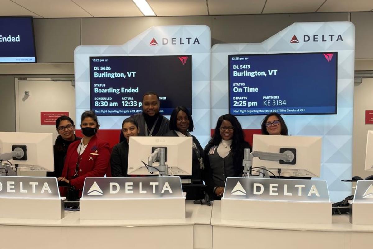 Delta employees stand at a gate in Delta's newly consolidated Terminal 4 at New York City - JFK.
