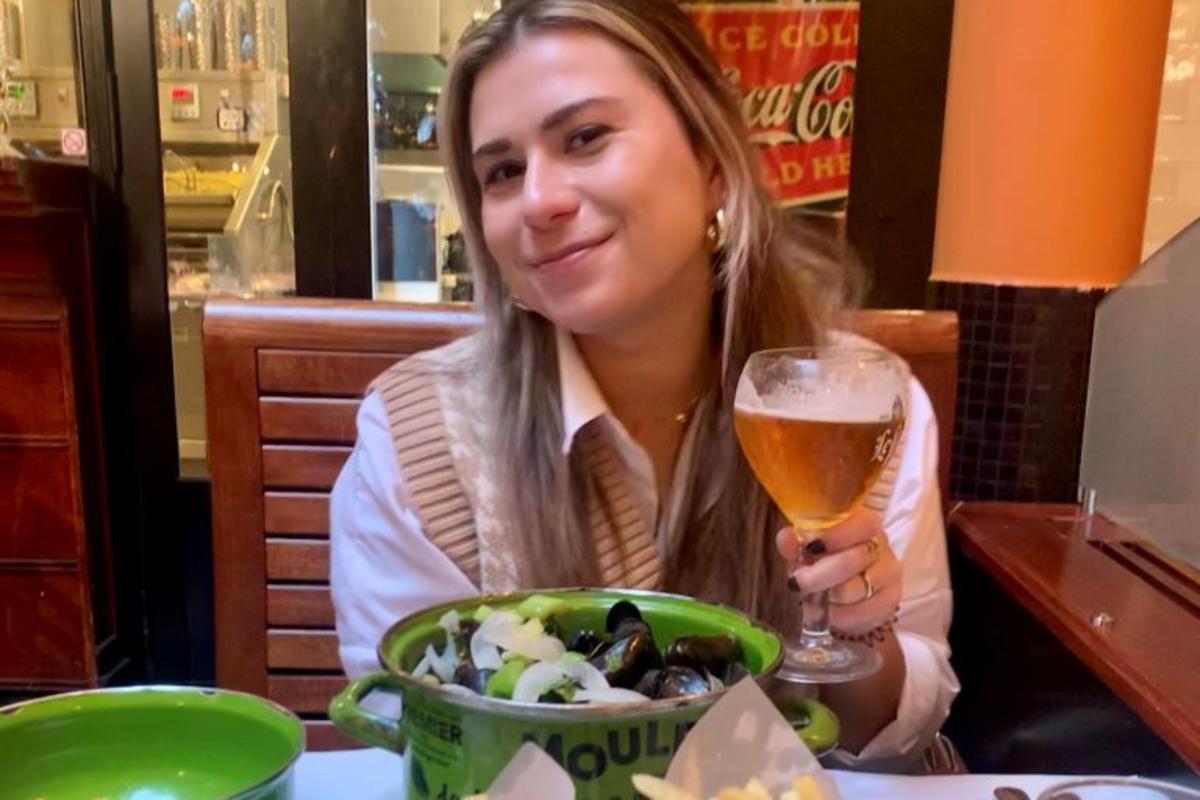 A Delta employee enjoys a meal of moules frites in Brussels