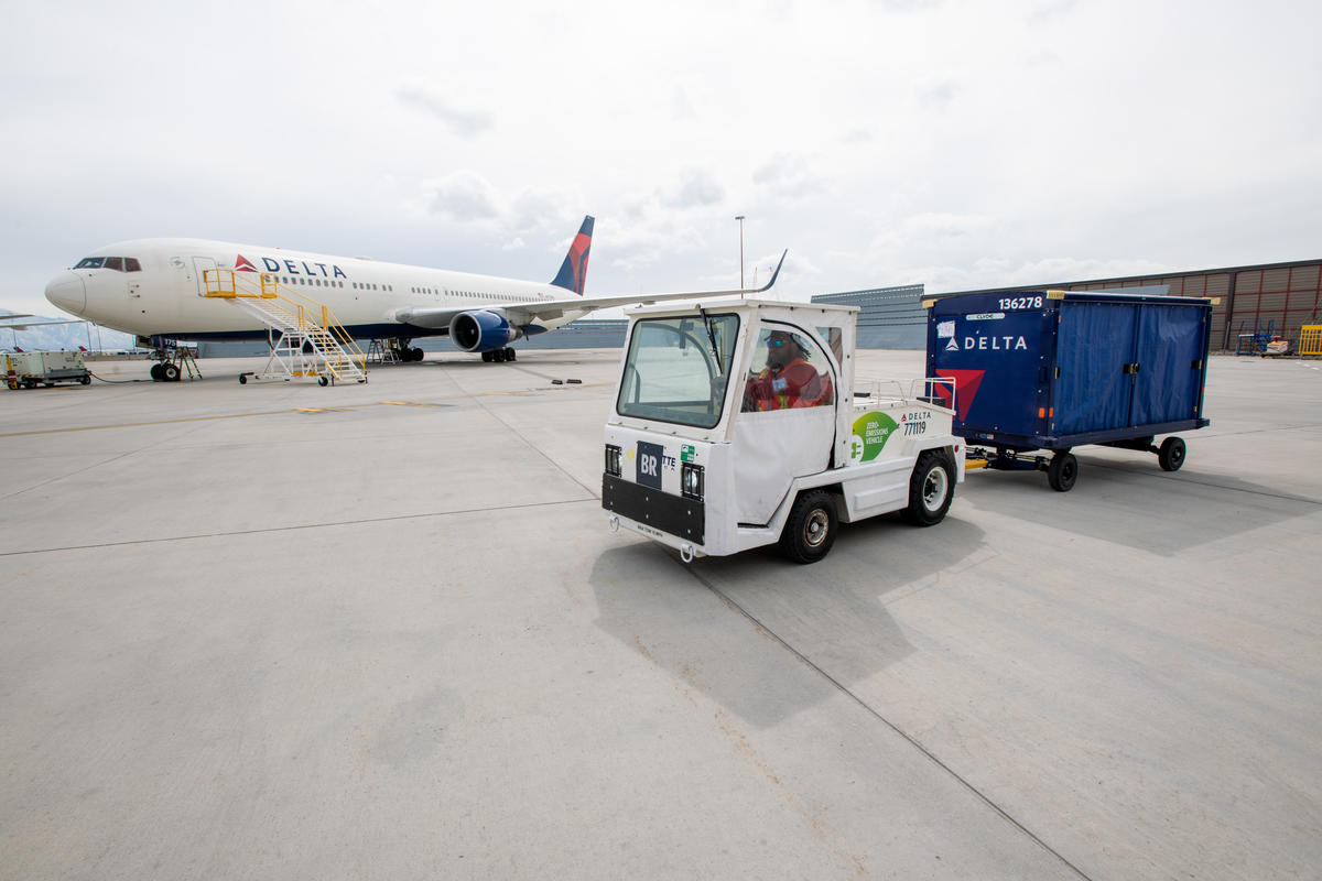 Delta Aircraft Load Agent Thomas Tuikolovatu operates an electric bag tractor at Salt Lake City International Airport (SLC).