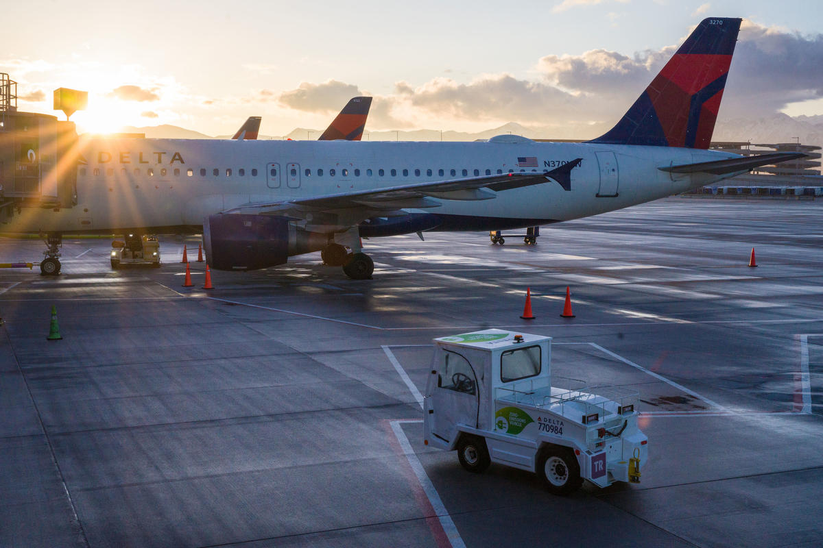 An electric bag tractor with a “zero-emission” vehicle decal is seen on the ramp at Salt Lake City International Airport (SLC).