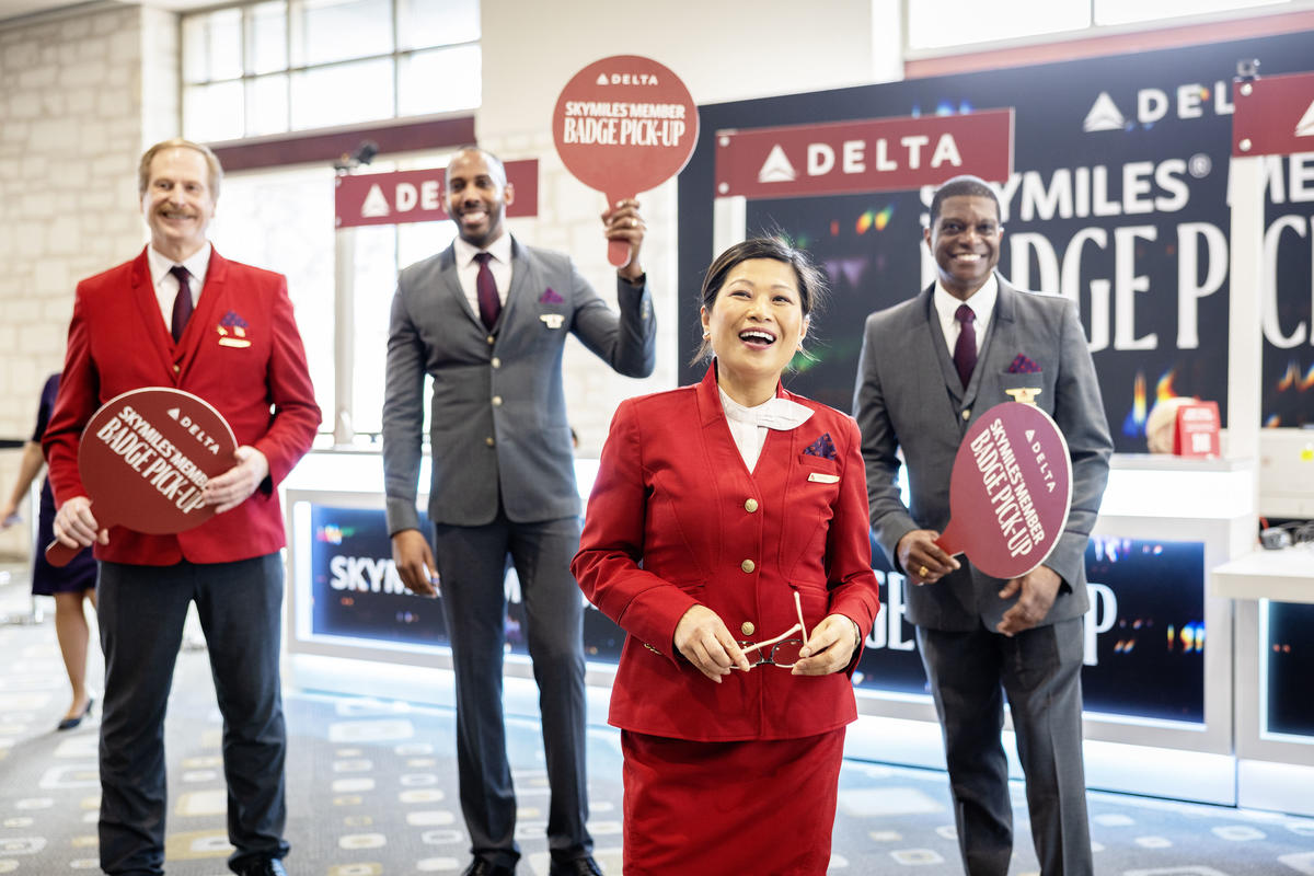Austin-based flight attendants and Red Coats assist in assisting guests with a dedicated badge pick-up area for SkyMiles Members at the Austin Convention Center Rotunda Foyer during SXSW 2024.