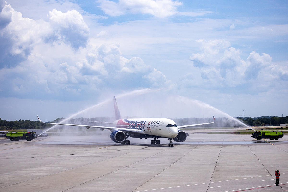 A water cannon welcomes Delta's Team USA plane back to Atlanta, Georgia.