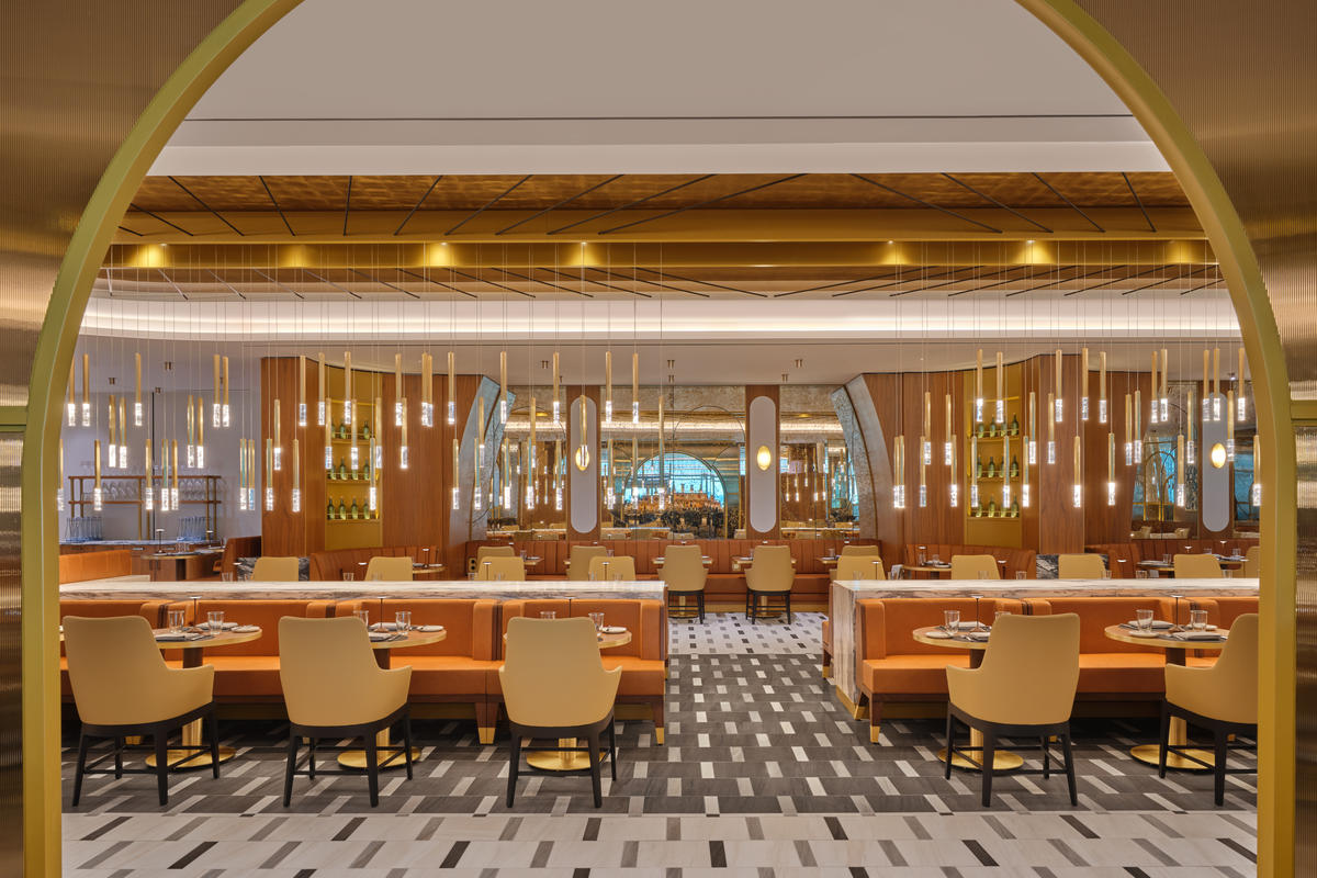 The iconic overlapping strands of the Brooklyn Bridge provided inspiration for the suspended lighting fixture in the dining room at The Delta Lounge-JFK.