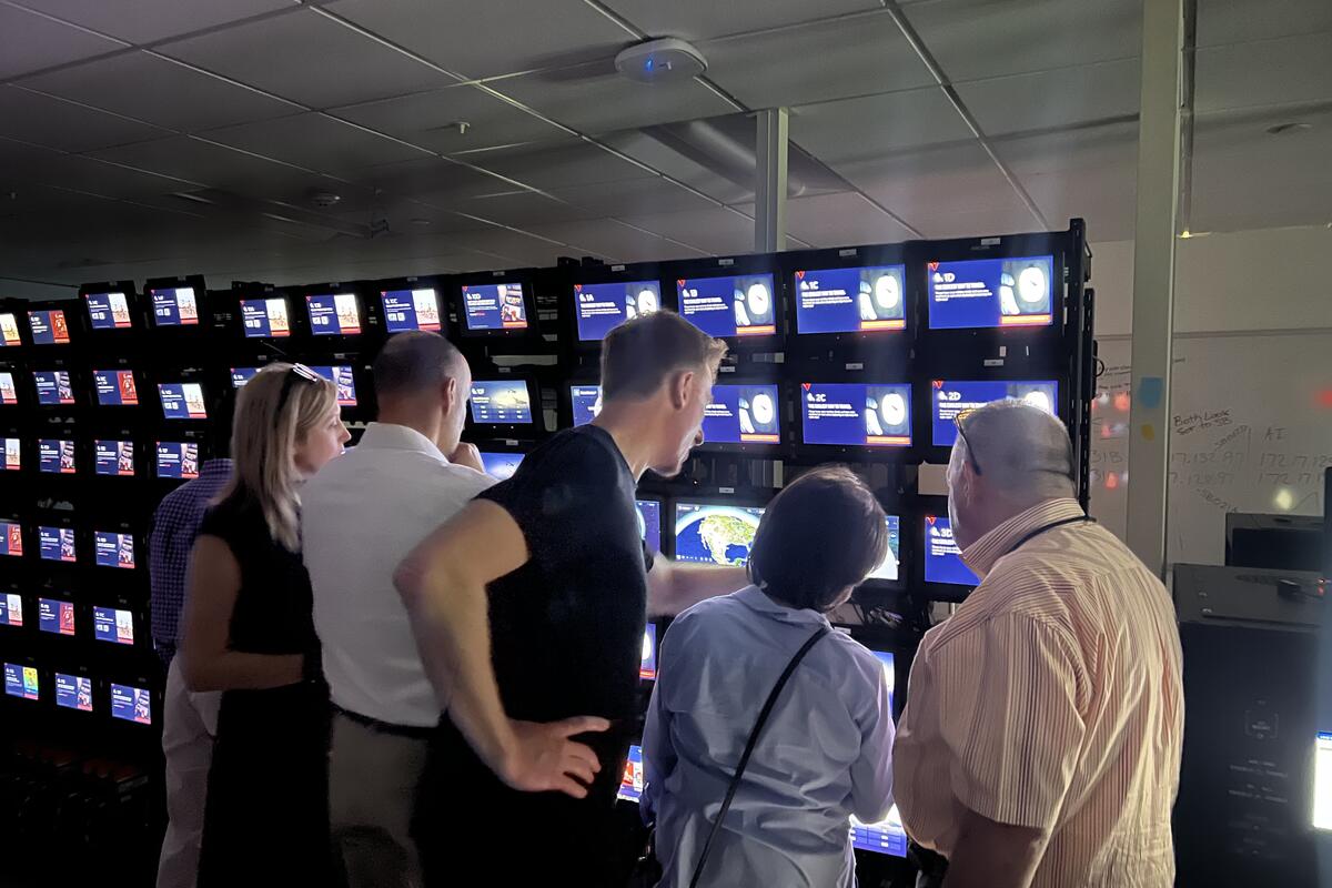 Members of the Advisory Board on Disability test Delta's new flight map in the In-Flight Entertainment lab.