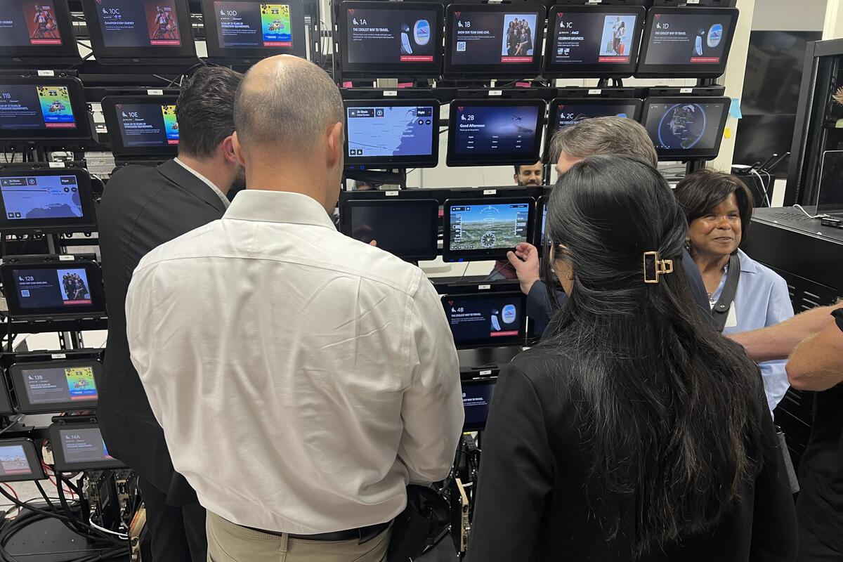 Members of the Advisory Board on Disability test Delta's new flight map in the In-Flight Entertainment lab.