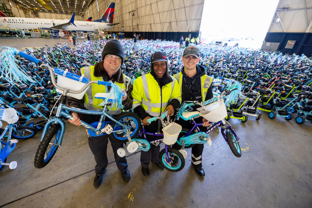 TechOps delivers holiday cheer with record bike and toy donations