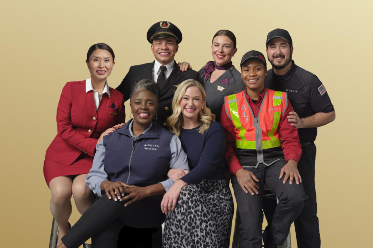 Delta people from across the airline's business pose in this 2024 photo.