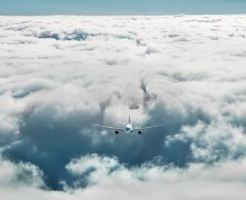 Plane flying through clouds.