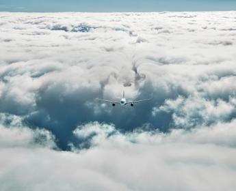 image of N8 Plane flying in clouds