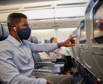 Delta customer using in-flight entertainment system
