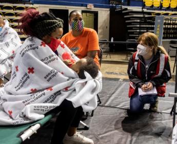 Families receive help at an American Red Cross shelter.