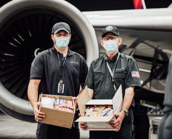 TechOps employee and veteran ships out 7,000th care package to military