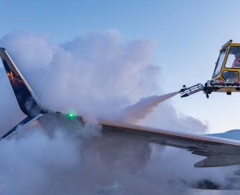 Deicing truck spraying down the wing of a Boeing 737-900ER