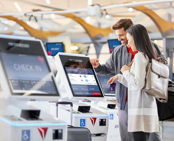 Delta customers checking in at kiosk