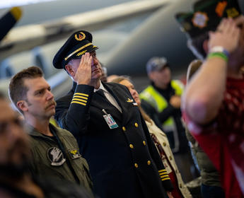 A Delta pilot salutes during the veterans appreciation event on Nov. 4, 2022.