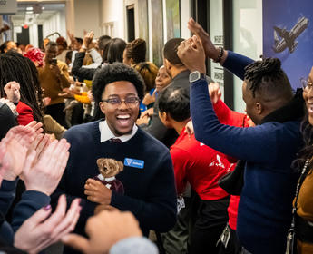 A student of Delta's new Business Class Program is welcomed at the Delta World Headquarters in Atlanta.