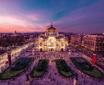 The Palacio de Bellas Artes in Mexico City gleams at twilight.